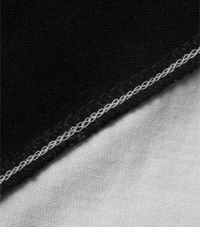 Close-up of a black and gray fabric edge with stitching detail